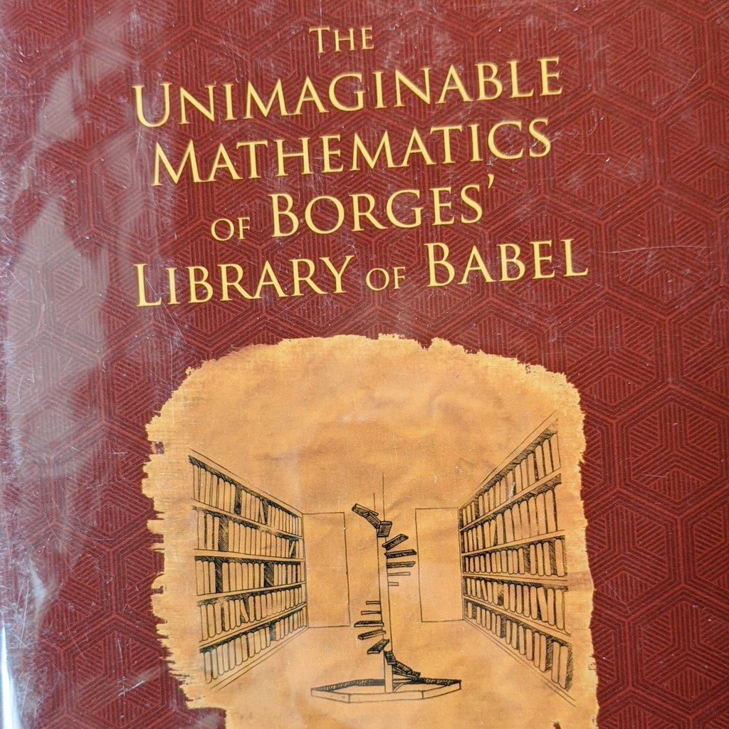 The cover of a book titled "The Unimaginable Mathematics of Borges' Library of Babel" features a dark red background with a subtle geometric pattern. A stylized illustration of a library with tall bookshelves and a spiral staircase is centered on the lower half of the cover.