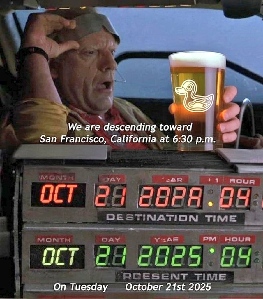 A scene from Back to the Future Part II showing Doc Brown in the DeLorean, holding a pint of beer with a duck logo. Below him, the time circuits display a destination time of October 21, 2025.